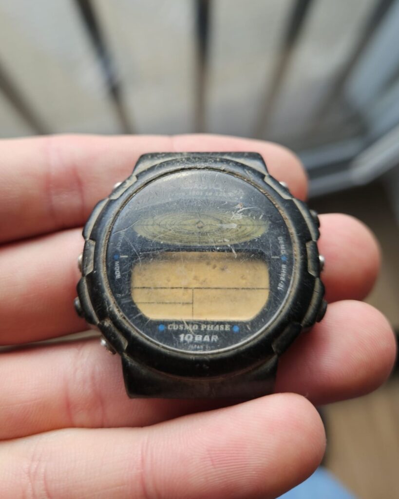 Worn and scratched Casio CGW-50 Cosmo Phase watch before restoration.