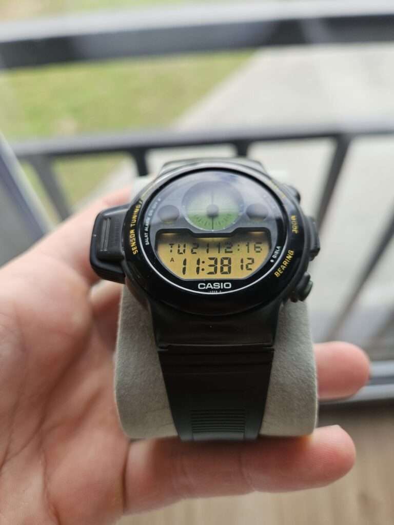 Casio CPW-310 black digital wristwatch with compass and prayer time display.