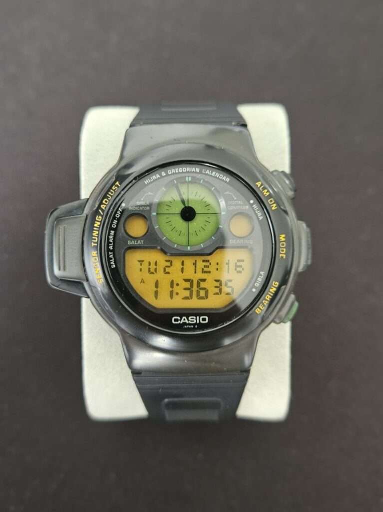 Casio CPW-310 wristwatch displayed on gray cushion for presentation.