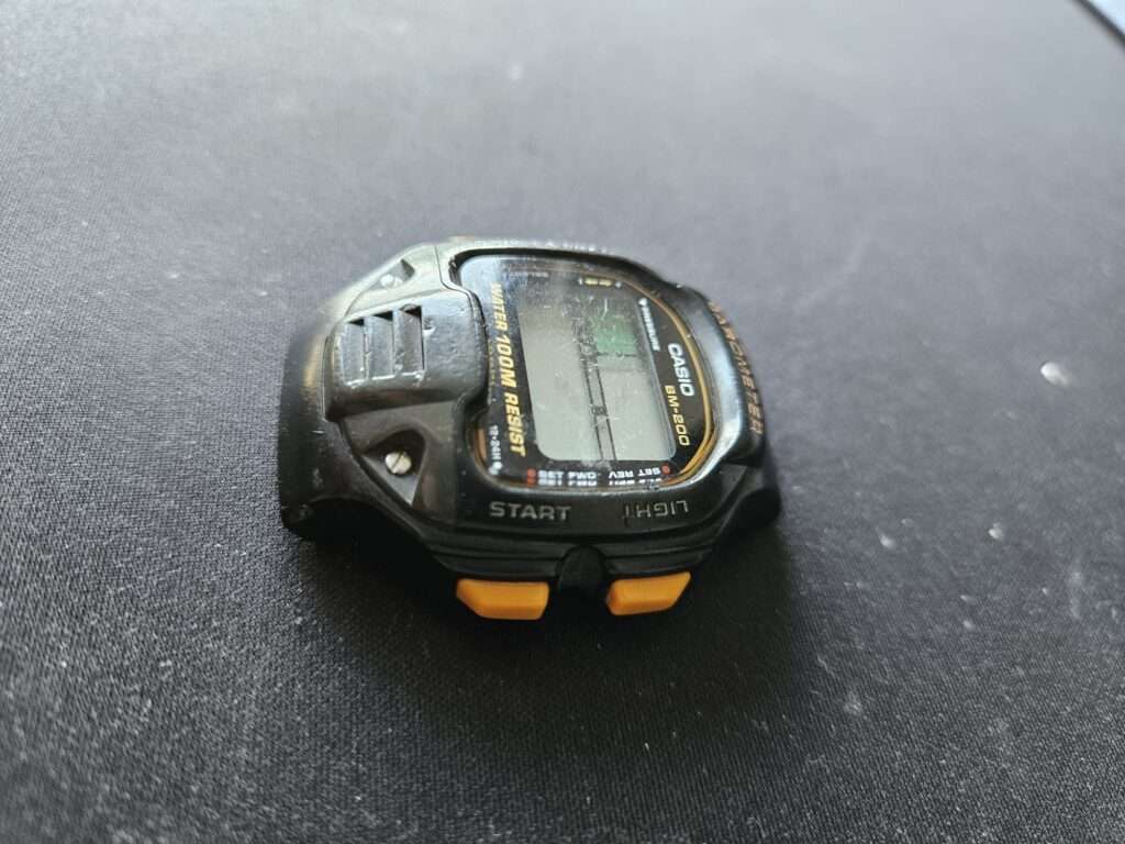 Casio BM-200 barometer watch lying on its side before refurbishment.