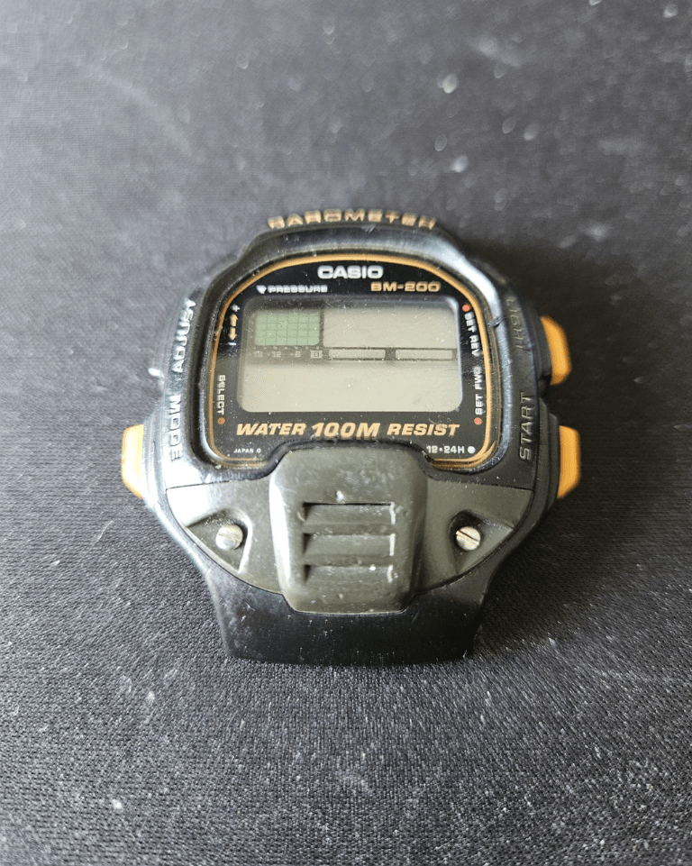 Casio BM-200 barometer watch in worn condition before restoration.