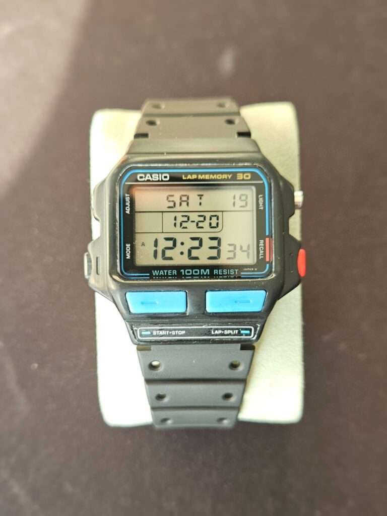 Casio SDB-500 digital watch showing active display with time and date visible.