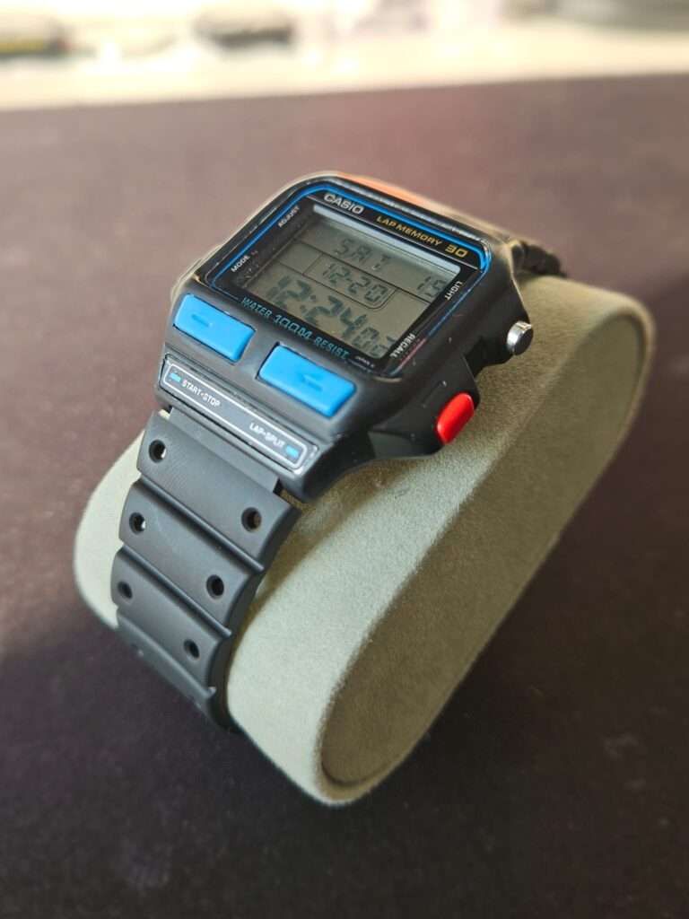 Angled view of a Casio SDB-500 vintage digital watch displayed on a foam stand.