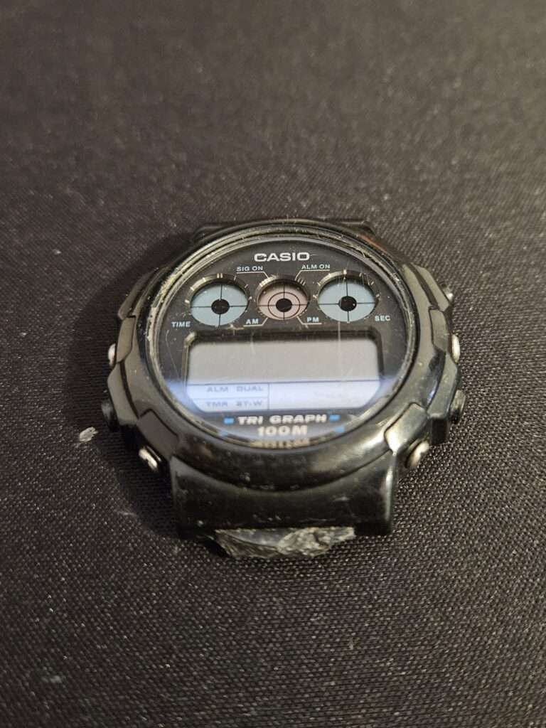 Casio TGW-10 Tri Graph watch face photographed upside down