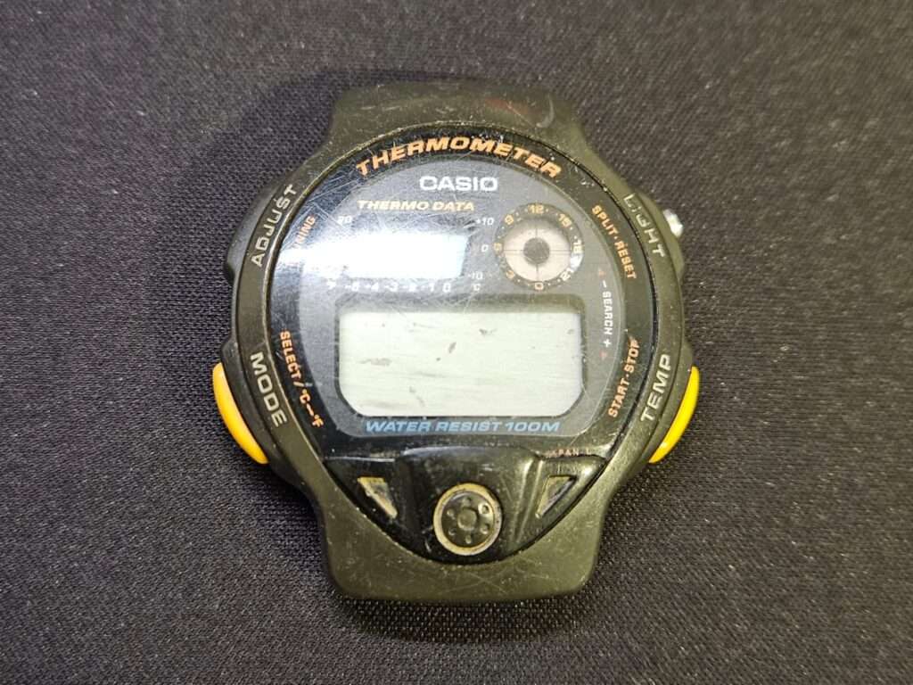 Casio TS-200 digital watch front with thermometer display and water resistance markings