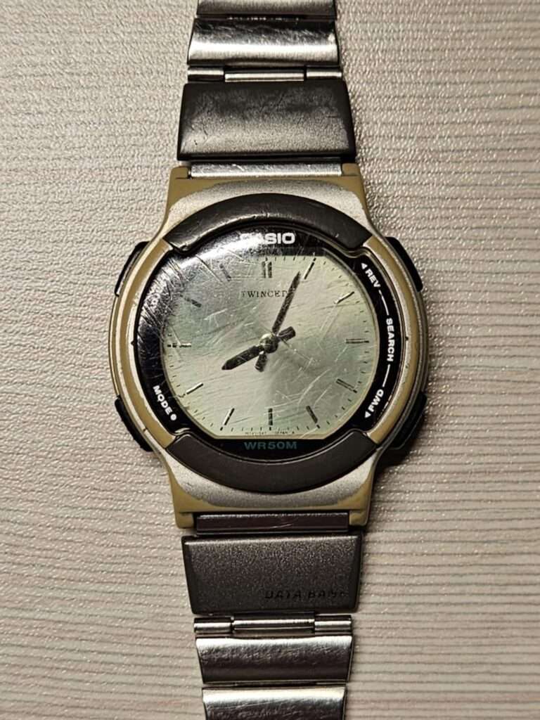 Casio ABX-53 Twincept full front view with steel bracelet, scratched silver dial, WR50M, Data Bank clasp, pre-restoration