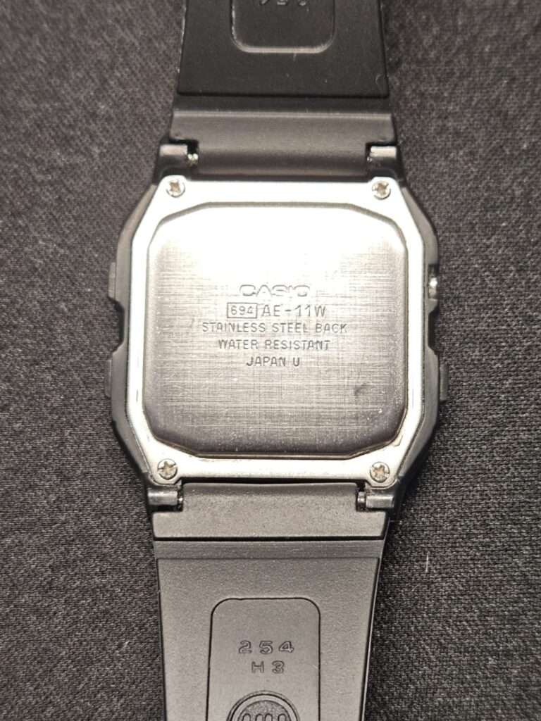 Restored Casio AE-11W module 694 stainless steel case back cleaned and polished with black resin strap