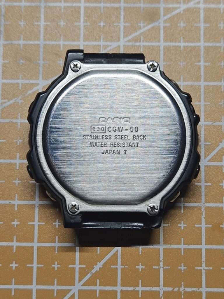 Casio CGW-50 830 stainless steel case back water resistant made in Japan, four corner screws visible