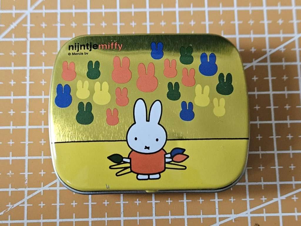 Casio CMD-30 watch shipped inside a vintage Nijntje Miffy yellow tin box used as packaging