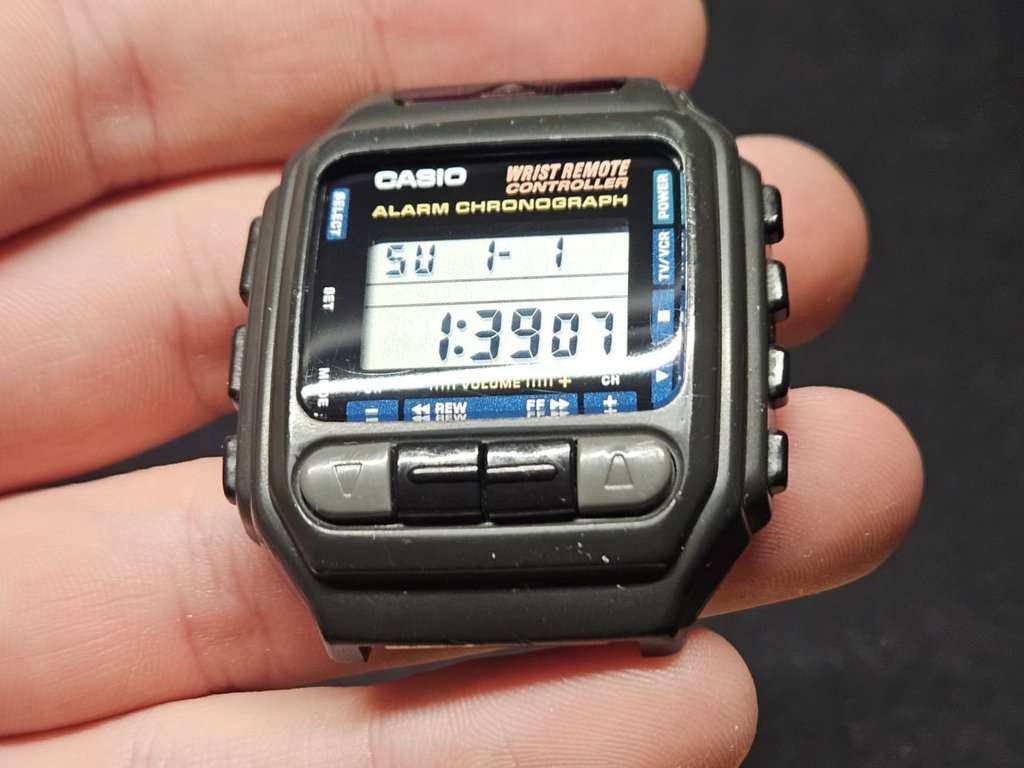 Restored Casio CMD-30 Wrist Remote Controller held in hand showing clear LCD display reading 1:39:07