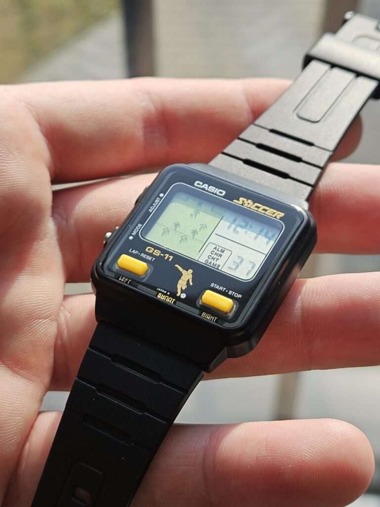 Casio GS-11 Soccer vintage game watch restored front view with complete black strap and active LCD game display
