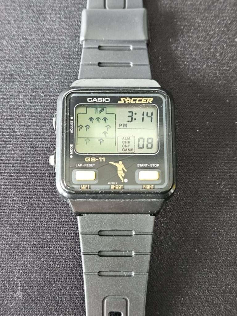 Casio GS-11 Soccer game watch fitted with Casio F-91W black resin strap compatibility test before restoration