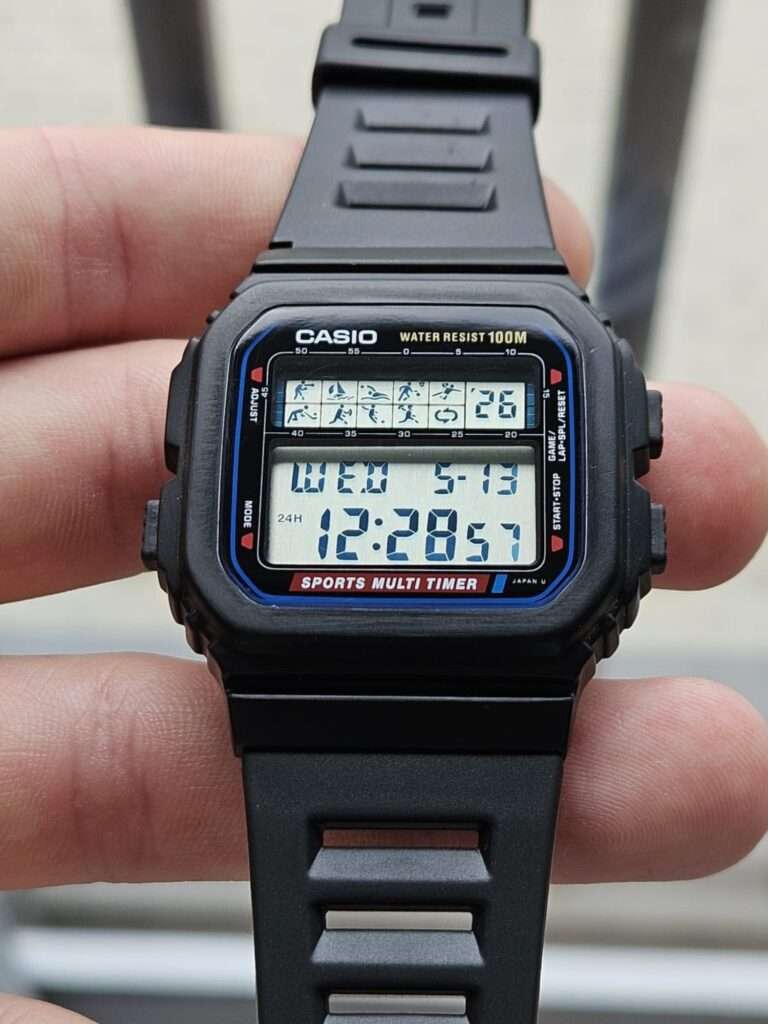 Casio STW-100 Sports Multi Timer restored, clear LCD showing sport icons, WED 5-13, 12:28 in 24H mode