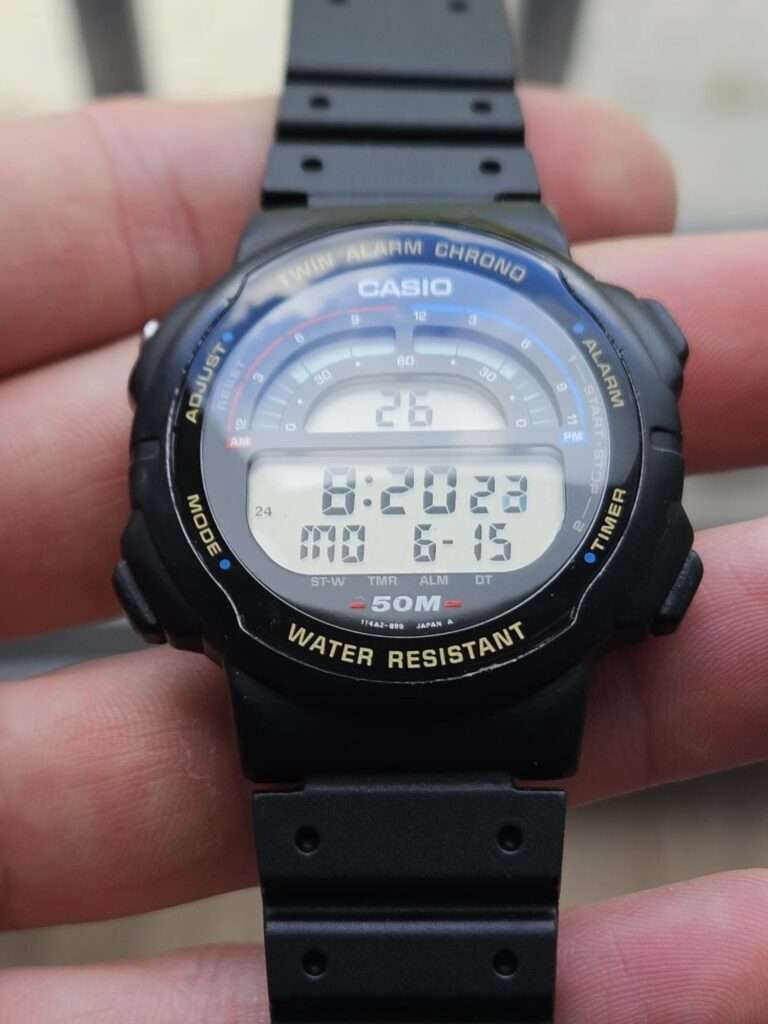 Restored Casio W-95 digital watch front with polished crystal showing 8:20 Monday and 50M water resistant dial