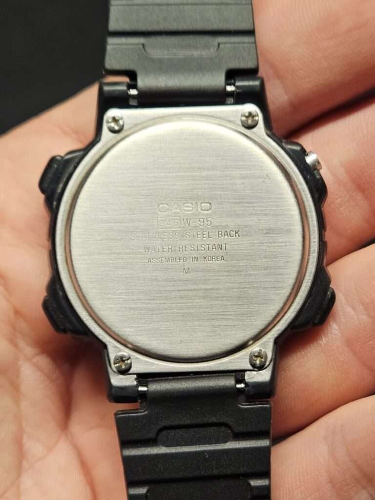 Cleaned Casio W-95 stainless steel case back engraved with model 945 W-95 and assembled in Korea markings