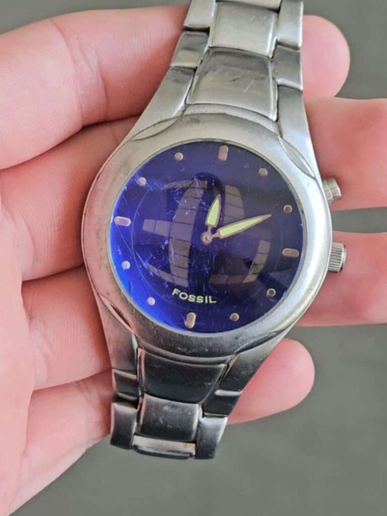 Fossil Big Tic JR8096 with heavily scratched crystal, blue globe dial, stainless bracelet, before restoration