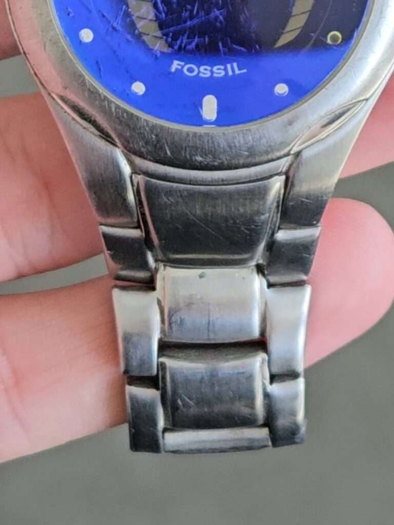 Fossil Big Tic JR8096 with blue dial and stainless steel bracelet, side view showing link detail, pre-restoration