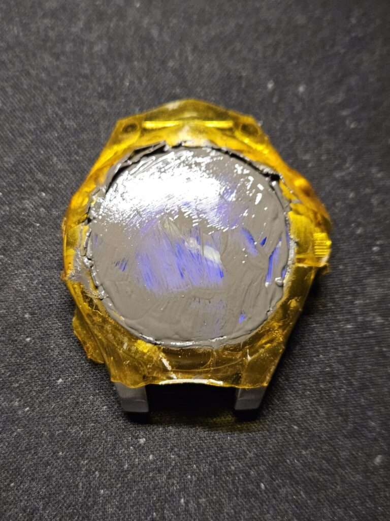 Fossil Big Tic JR8096 watch case with yellow resin holder during mineral glass polishing using PolyWatch compound