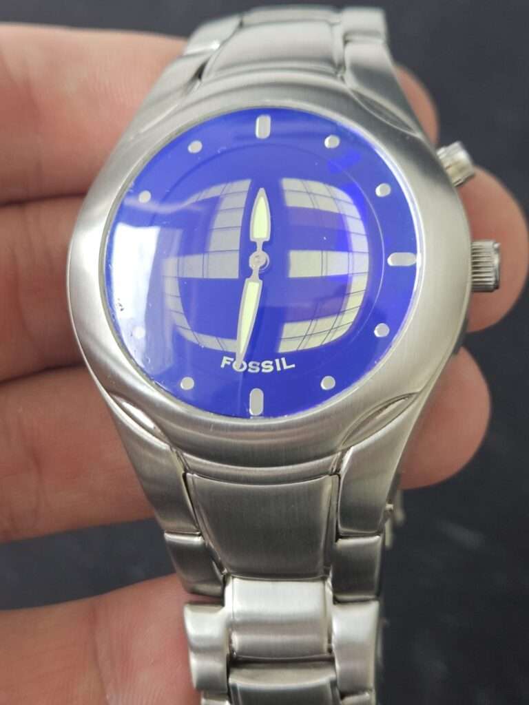 Fossil Big Tic JR8096 after restoration, front view with clear polished blue globe dial, green lume hands, stainless bracelet