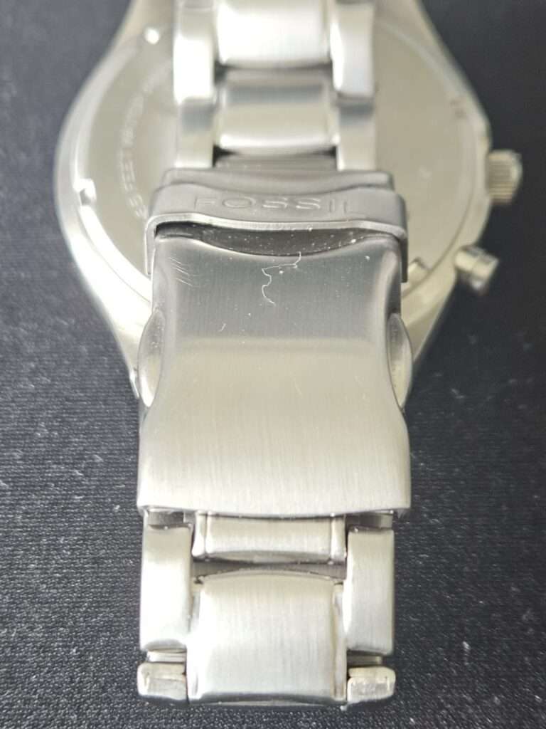 Fossil Big Tic JR8096 reverse view showing brushed stainless deployment clasp with Fossil logo after restoration