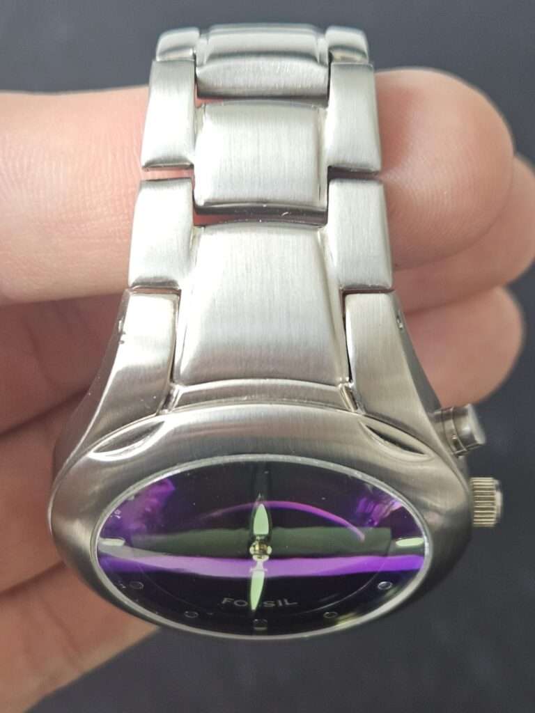 Fossil Big Tic JR8096 top view after restoration showing polished brushed bracelet and purple-tinted blue dial
