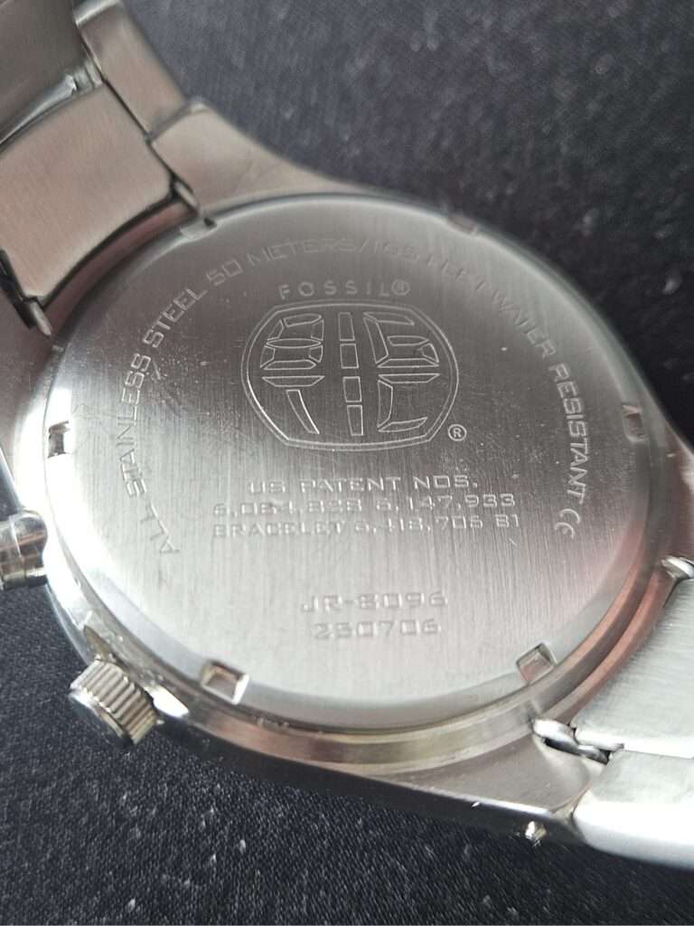 Fossil Big Tic JR8096 stainless case back with engraved globe logo, model number JR-8096, 50m water resistance marking