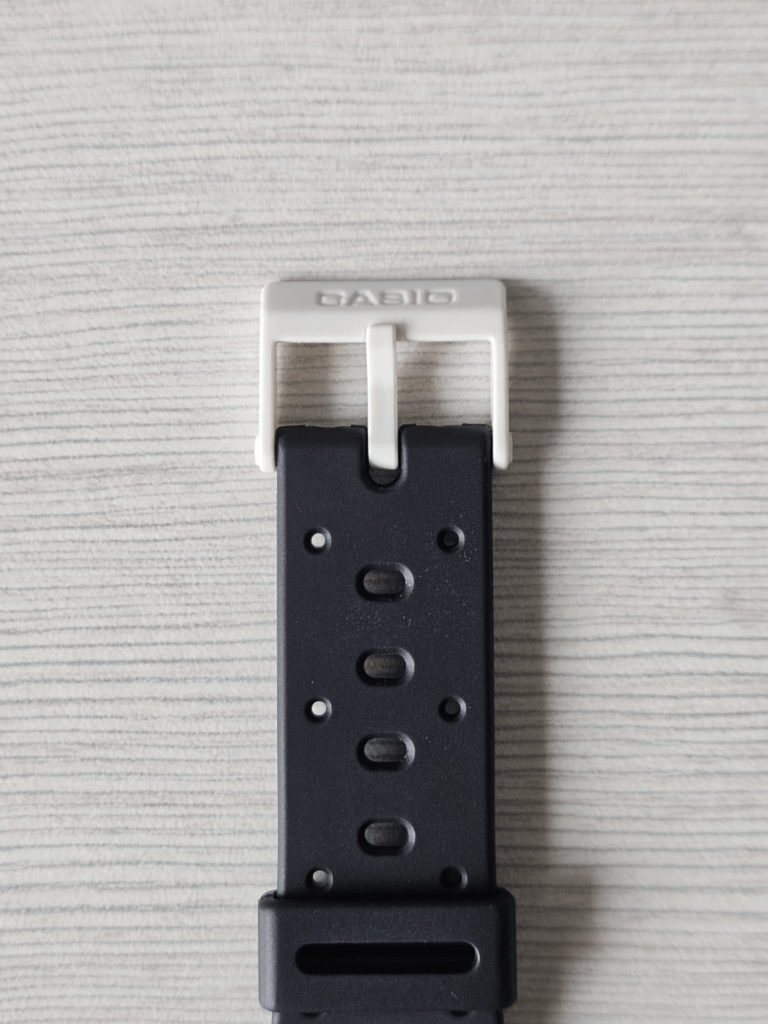 Original white Casio buckle clasp fitted onto replacement black watch strap