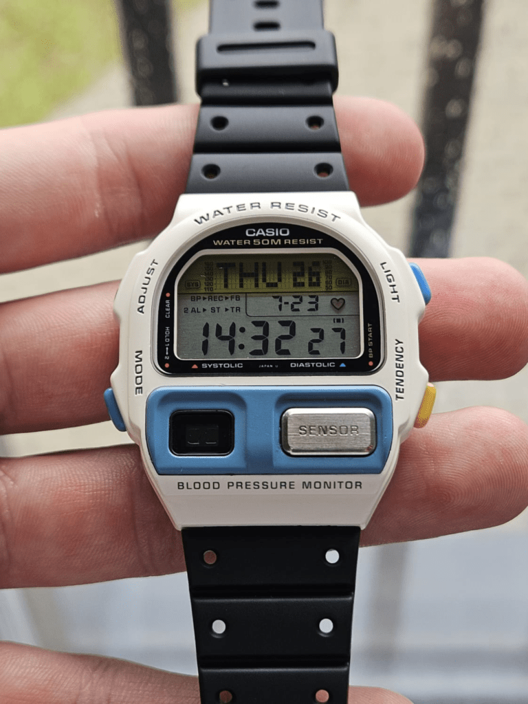 Restored white Casio BP-100 watch photographed outdoors with black strap