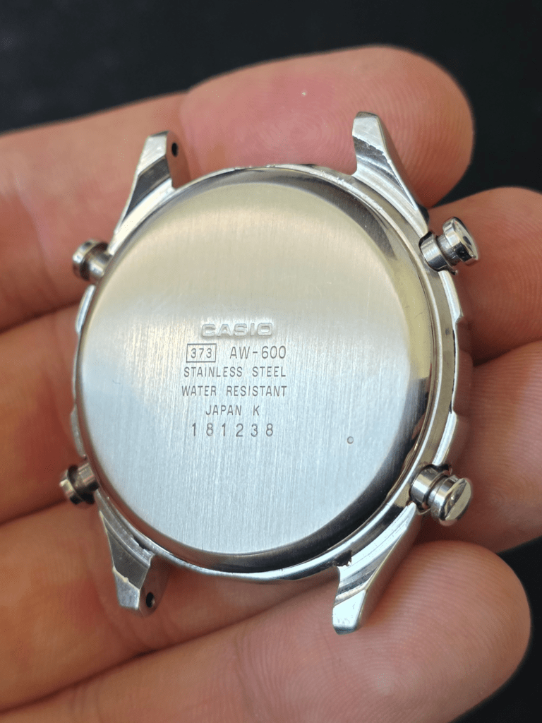 Casio AW-600 stainless steel caseback showing model number and water resistant markings