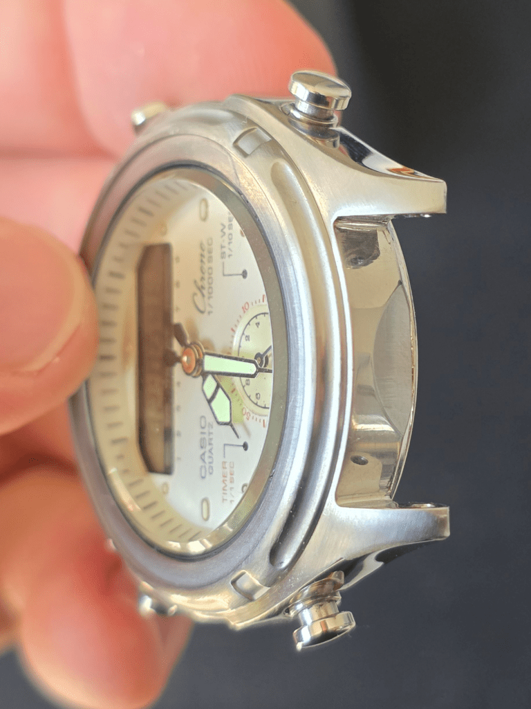 Casio AW-600 quartz chronograph watch case shown in side profile after restoration with polished steel finish