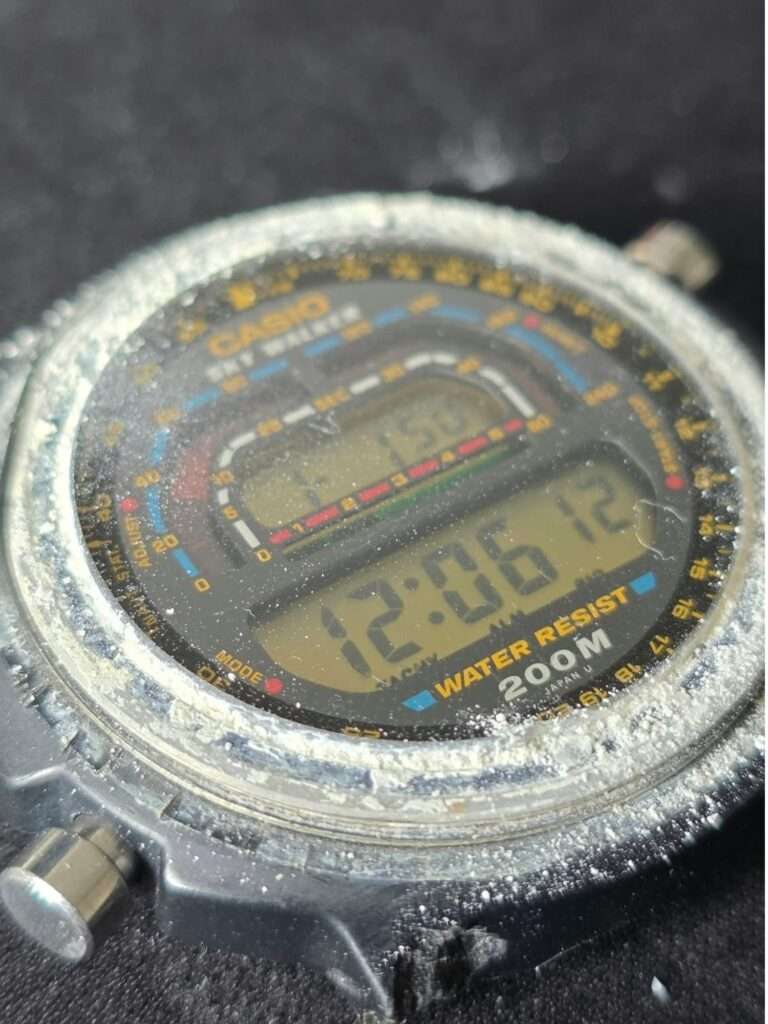 Casio DW-401 Sky Walker with bezel removed, decades of white dirt and grime around crystal and case